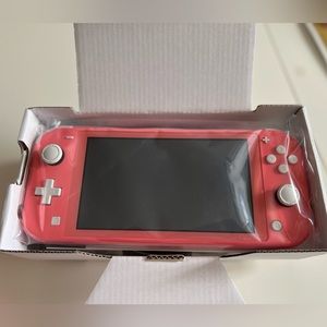 Nintendo Switch Lite. Animal crossing game. Mariokart deluxe game